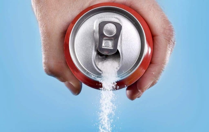 pouring-sugar-out-of-soda-can