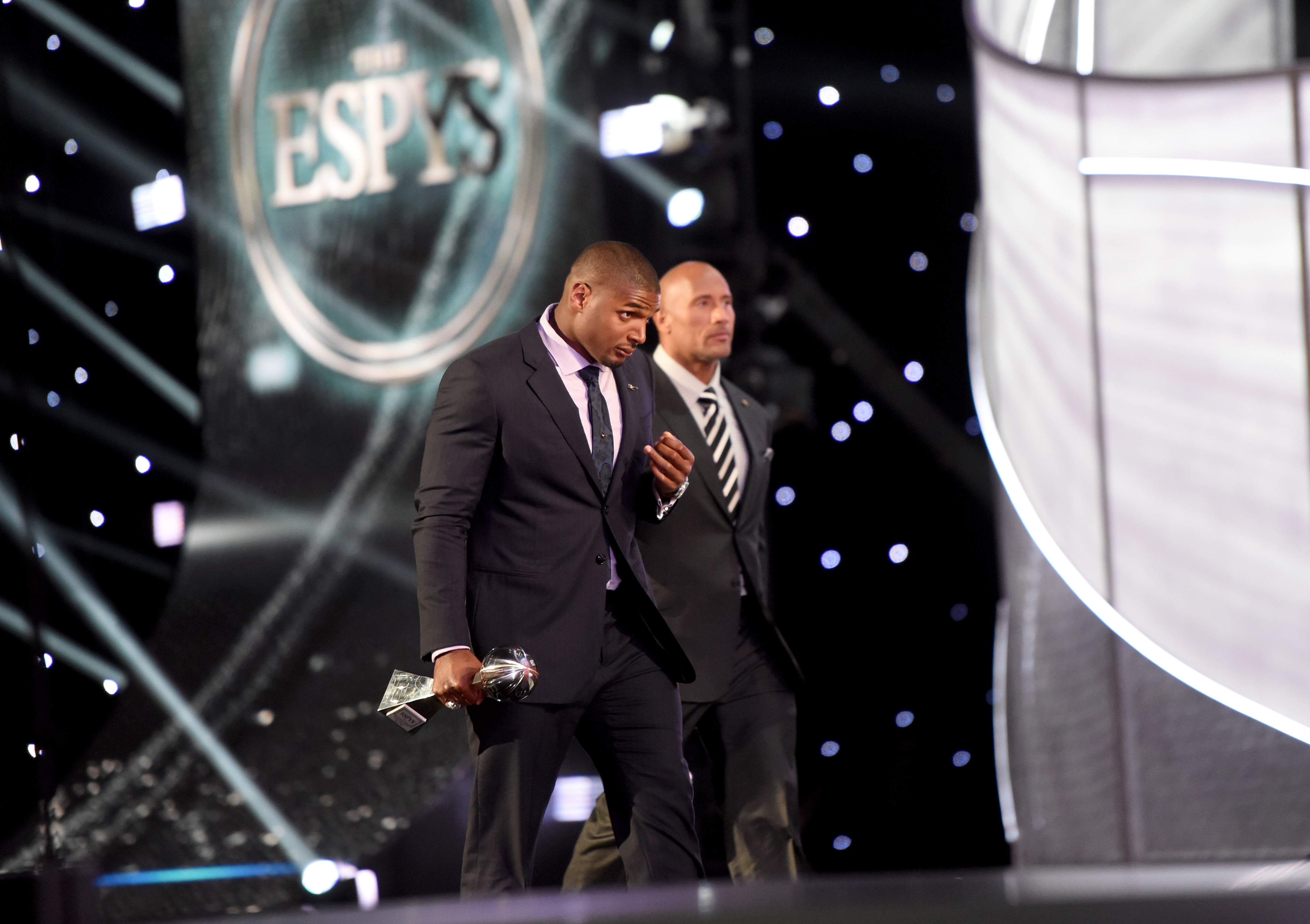 LOS ANGELES, CA - JULY 16:  NFL player Michael Sam accepts the Arthur Ashe Courage Award from actor Dwayne 'The Rock' Johnson onstage during The 2014 ESPYS at Nokia Theatre L.A. Live on July 16, 2014 in Los Angeles, California.  (Photo by Michael Buckner/Getty Images For ESPYS)
