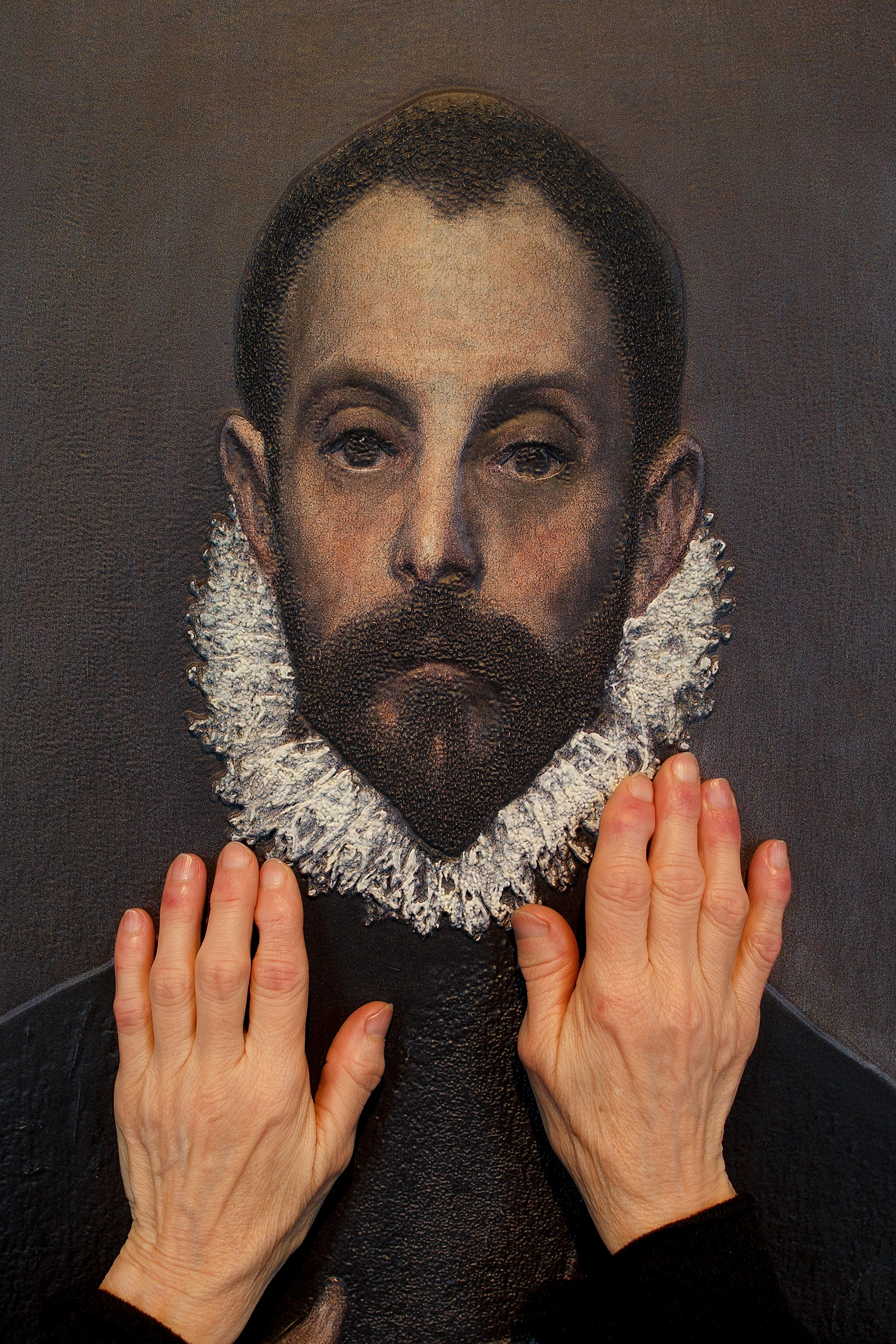 MADRID, SPAIN - FEBRUARY 10: A blind person feels with her hands a copy of 'The gentleman with his hand on his chest' of El Greco at The Prado Museum on February 10, 2015 in Madrid, Spain. 'Hoy toca el Prado' (Touch The Prado) allows blind or vision-impaired visitors to explore with their hands the copies of six masterworks. The copies were created using a technique called 'Didu' which provides texture and volume to the paintings. (Photo by Pablo Blazquez Dominguez/Getty Images)
