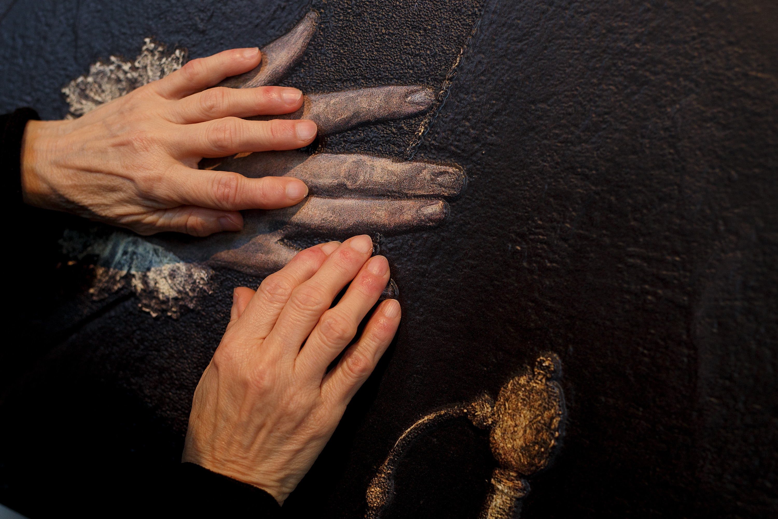 MADRID, SPAIN - FEBRUARY 10: A blind person feels with her hands a copy of 'The gentleman with his hand on his chest' of El Greco at The Prado Museum on February 10, 2015 in Madrid, Spain. 'Hoy toca el Prado' (Touch The Prado) allows blind or vision-impaired visitors to explore with their hands the copies of six masterworks. The copies were created using a technique called 'Didu' which provides texture and volume to the paintings. (Photo by Pablo Blazquez Dominguez/Getty Images)