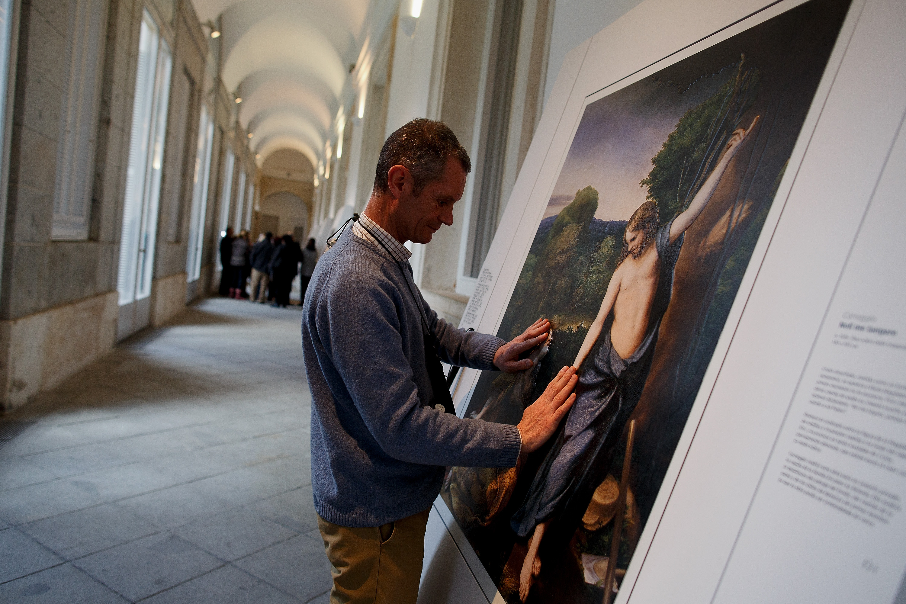 MADRID, SPAIN - FEBRUARY 10: A blind person feels with his hands a copy of 'Don't touch me' (Noli me tangere) of Antonio da Correggio at The Prado Museum on February 10, 2015 in Madrid, Spain. 'Hoy toca el Prado' (Touch The Prado) allows blind or vision-impaired visitors to explore with their hands the copies of six masterworks. The copies were created using a technique called 'Didu' which provides texture and volume to the paintings. (Photo by Pablo Blazquez Dominguez/Getty Images)