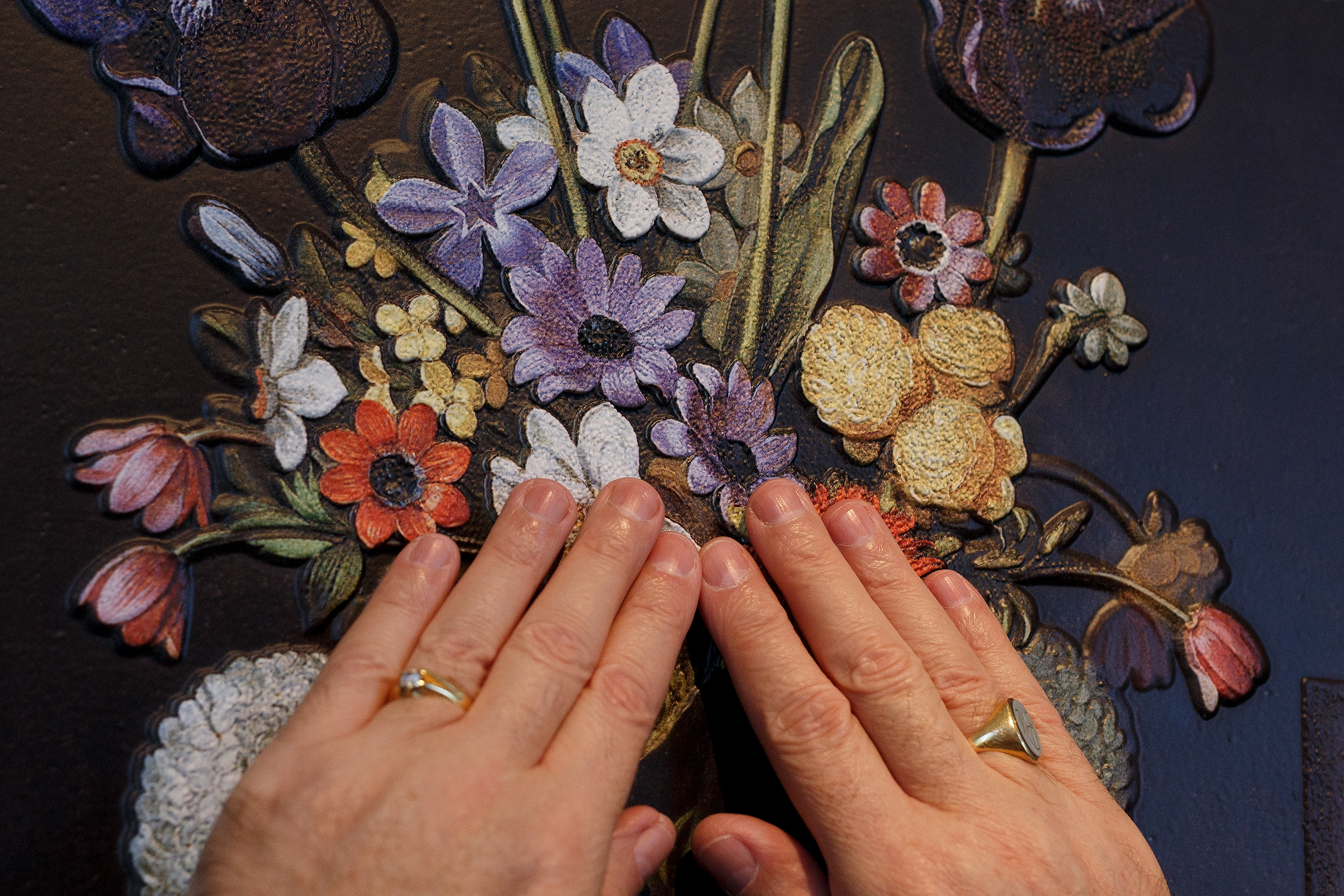 MADRID, SPAIN - FEBRUARY 10: A blind person feels with his hands a copy of 'Still life with Artichokes, Flowers and Glass Vessels' of Juan Van Der Hamen at The Prado Museum on February 10, 2015 in Madrid, Spain. 'Hoy toca el Prado' (Touch The Prado) allows blind or vision-impaired visitors to explore with their hands the copies of six masterworks. The copies were created using a technique called 'Didu' which provides texture and volume to the paintings. (Photo by Pablo Blazquez Dominguez/Getty Images)