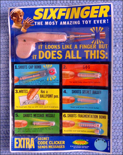 Esse brinquedo funciona como um truque de mágica: você ganha um sexto dedo de plástico. Mas o problema é que esse novo dedo funciona como uma arminha pra jogar coisas que machucam nos amiguinhos! 