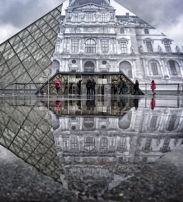 Artista francês JR cria ilusão de ótica com colagem de fotografia sobre a estrutura de vidro da pirâmide