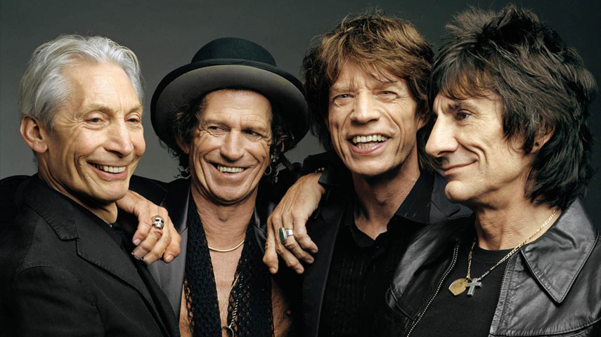 Mick e Keith, dois amigos de infância, se reencontraram em um trem na estação de Dartford, Inglaterra, em 1960, e descobriram um interesse em comum por rock and roll. Foram convidados pelo guitarrista Brian Jones, em 1962, a montar a banda The Rolling Stones, cujo nome é inspirado na música de Muddy Waters, Rollin' Stone.