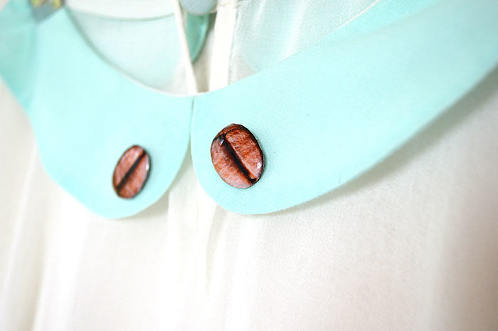 Broches de grão de café